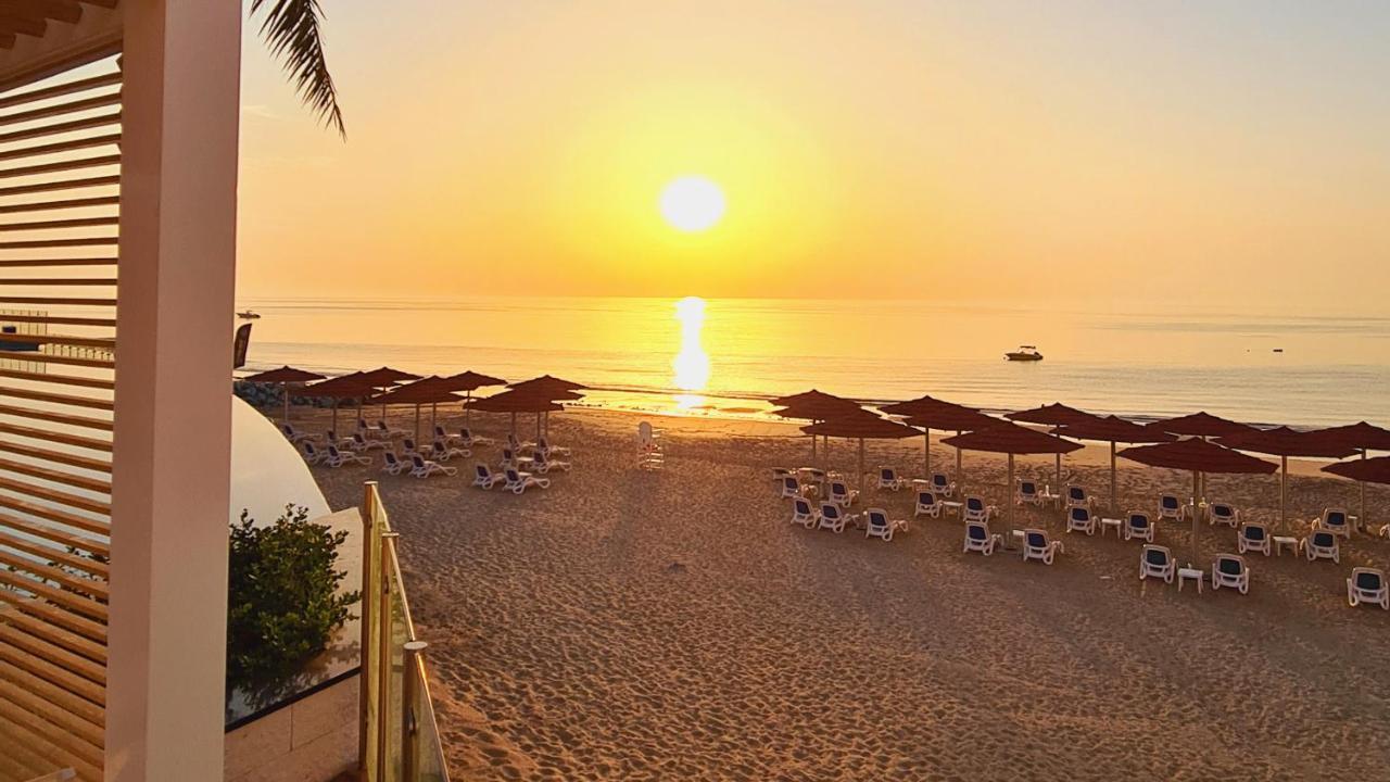 Royal M Al Aqah Beach Resort By Gewan Buitenkant foto Sunset at the beach