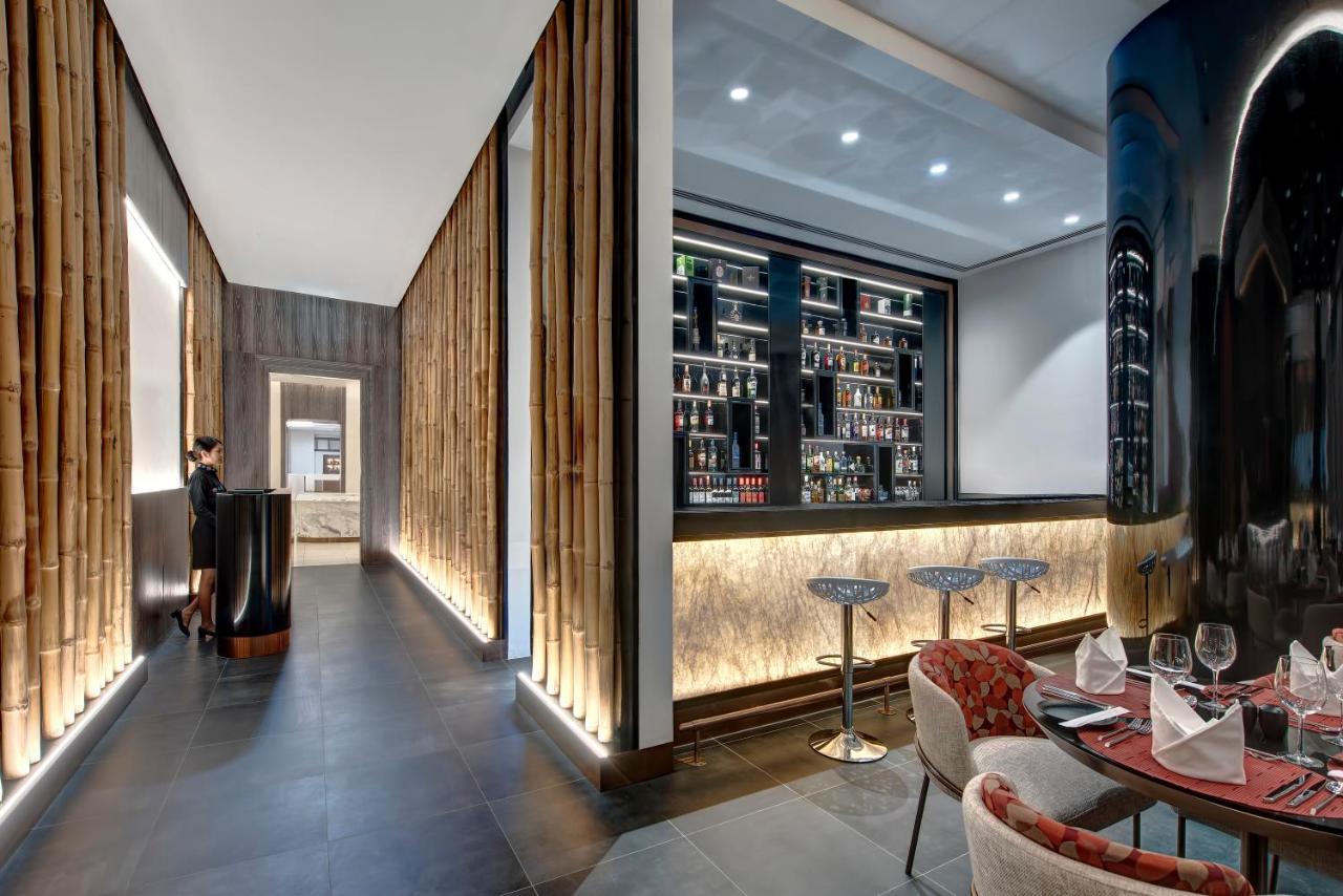 Royal M Al Aqah Beach Resort By Gewan Buitenkant foto The bar at the restaurant