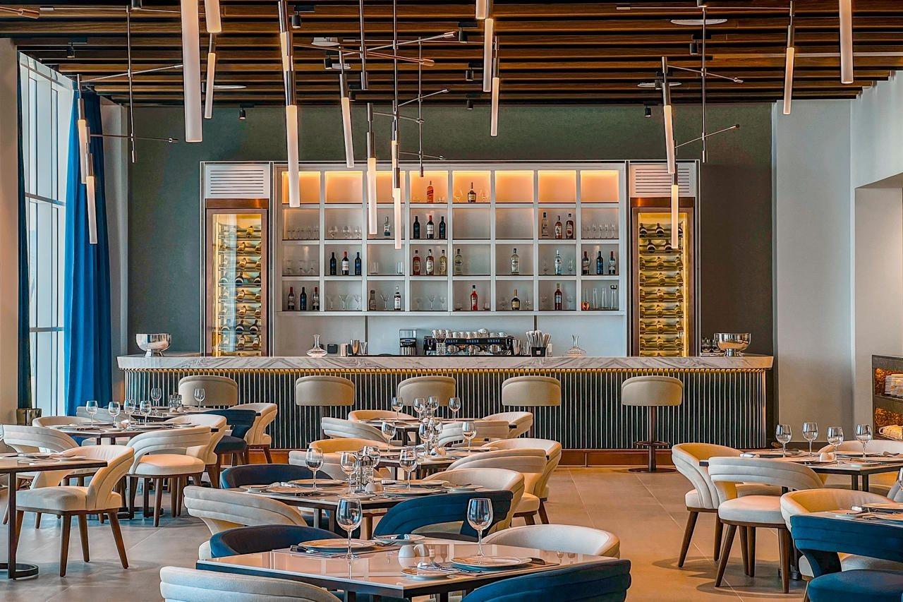 Royal M Al Aqah Beach Resort By Gewan Buitenkant foto The restaurant