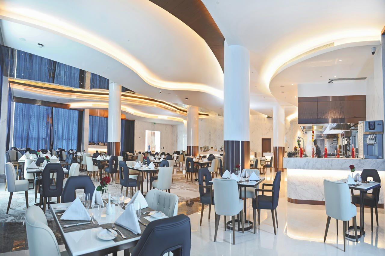 Royal M Al Aqah Beach Resort By Gewan Buitenkant foto The restaurant